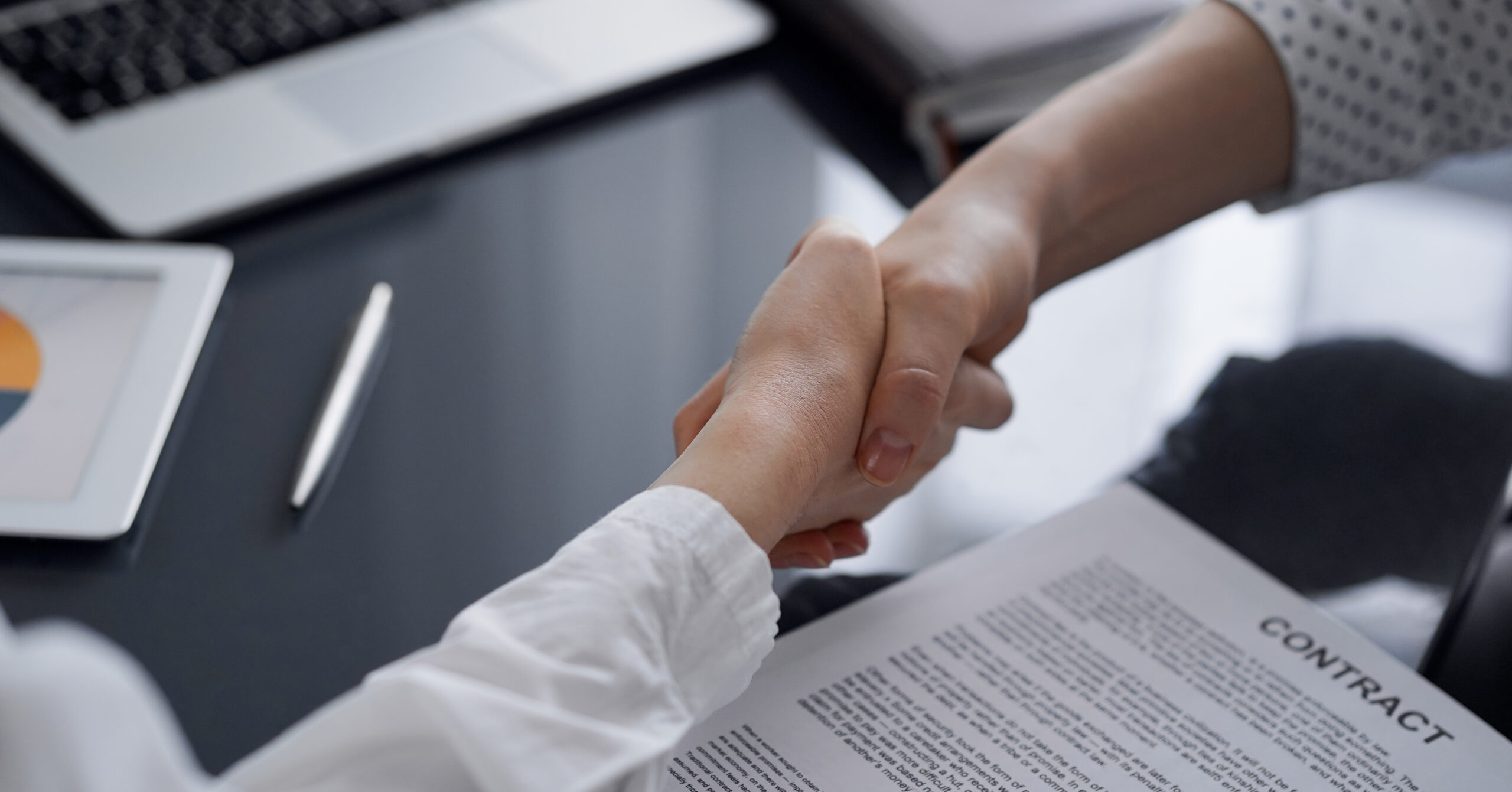 Business people signing contract